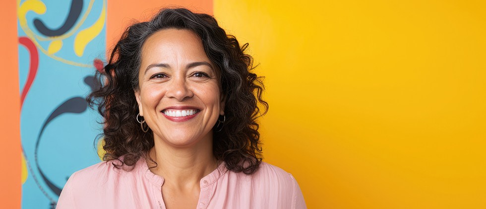 Woman smiling after seeing her Aetna dentist in Lincoln