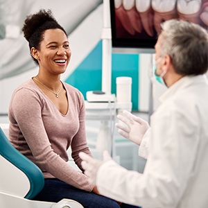 Woman smiling at the dentist’s office