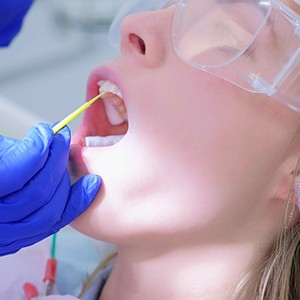 A patient getting fluoride treatment